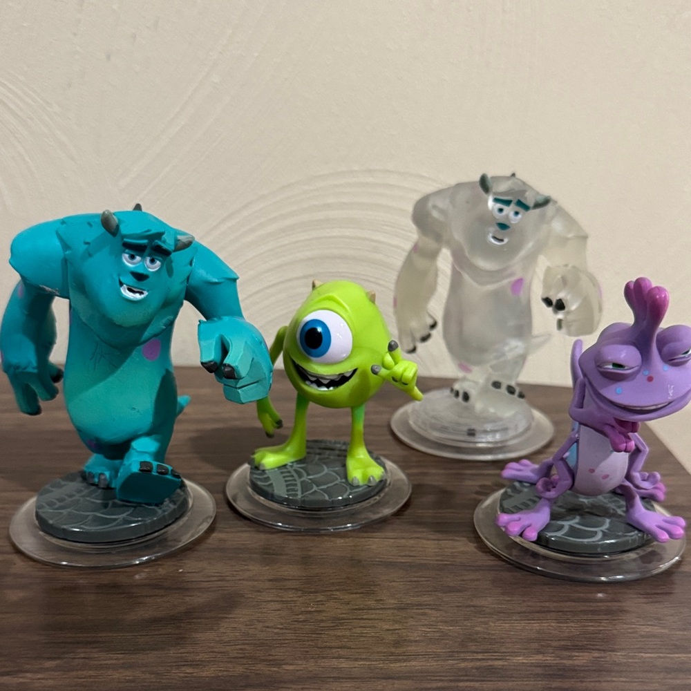 Monsters Inc. Figurine Set - Blue, Green, Purple, and Clear